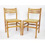 A set of six beech kitchen chairs, with rush seats,