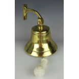 A brass ships bell with adjustable fitting,
