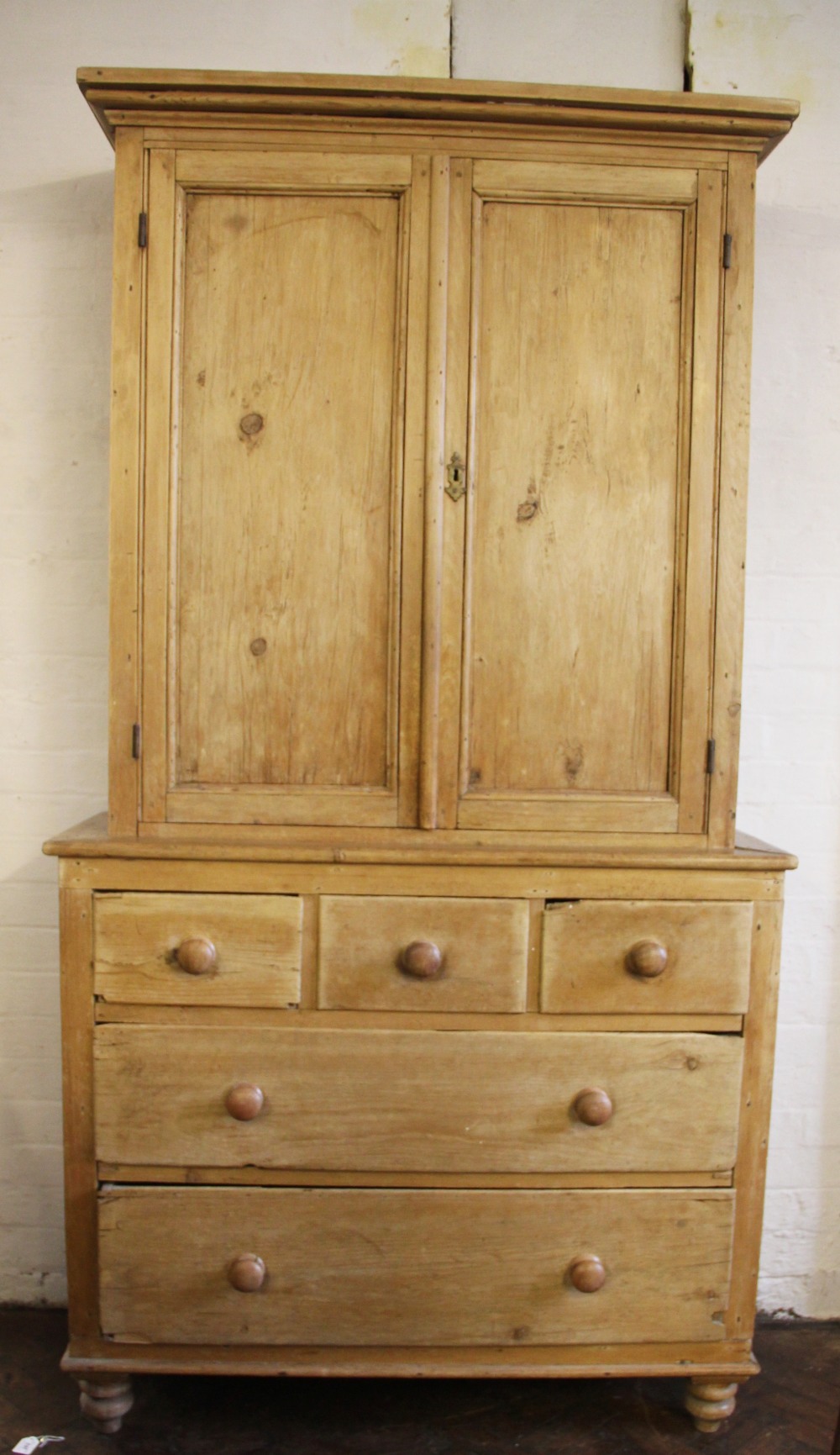 A Victorian pine house keepers cabinet, with moulded cornice and two cupboard doors,