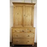 A Victorian pine house keepers cabinet, with moulded cornice and two cupboard doors,