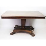 A William IV mahogany breakfast table, with octagonal column and platform, on paw feet,