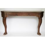 A Victorian carved oak console table, with drawer and canted corners, on cabriole legs and paw feet,