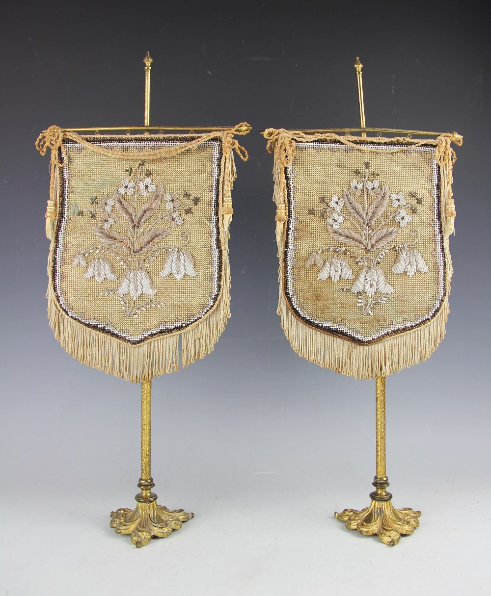 A pair of 19th century gilt metal table screens,