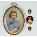 A pair of 19th century painted porcelain oval plaques, each depicting a young girl, 2cm high,