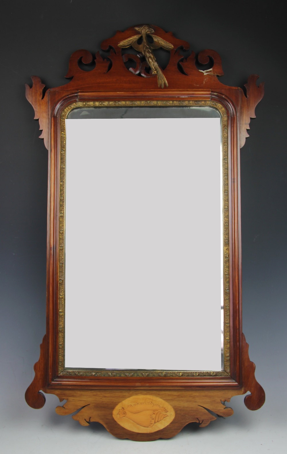 A George III and later mahogany fret frame wall mirror,