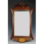 A George III and later mahogany fret frame wall mirror,