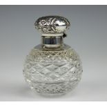 A silver topped cut glass globular scent bottle and stopper, Birmingham 1996,