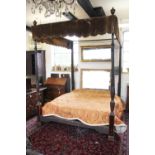 An Edwardian and later mahogany four poster bed, carved with Prince of Wales feathers,