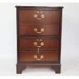 A modern mahogany two drawer filing cabinet, with leather inset top, on bracket feet,