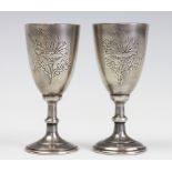 A pair of Russian silver goblets / Jewish Kiddush cups, each engraved with a poppy flower,