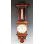 A Victorian carved oak barometer,