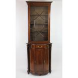 An early 20th century French rosewood display cabinet of slender proportions,