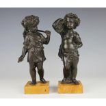 A pair of French 19th century bronze cherubs, personifying Summer and Autumn,