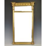 A Regency gilt wood and gesso pier mirror, of small proportions, with fluted Corinthian pilasters,
