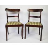 A set of six Regency mahogany dining chairs, with upholstered seats, on sabre legs,