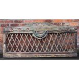 A Continental painted pine panel, possibly used as a bed head, with trellis detailing,