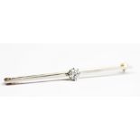 A diamond set bar brooch, the central old brilliant cut diamond,