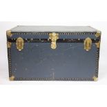 A large vintage metal bound steamer travelling trunk, with locking mechanism,
