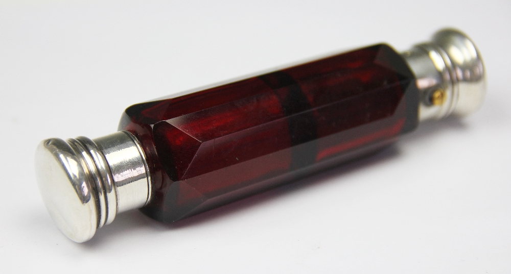 A Victorian double ended ruby glass and white metal mounted scent bottle,