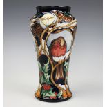 A Moorcroft limited edition Christmas Robin pattern vase, No.49/50. dated 'C.