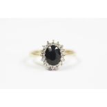 A sapphire and cz set oval cluster ring,