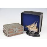 A white metal model of a sailing boat, stamped '925',