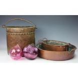 A copper two handled preserve pan, 51cm diameter including handles, with a smaller copper pan,