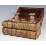 A 19th century cased decanter and liqueur set, converted from four antiquarian bound books,