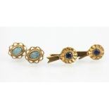 A pair of sapphire set 9ct yellow gold stud earrings in the form of rosettes and a pair of opal