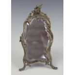 An early 20th century French bevelled boudoir mirror, with vine decoration florally surmounted,