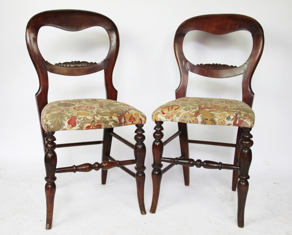 A set of six late Victorian stained beech dining chairs, with upholstered seats,