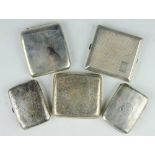A selection of five 19th and early 20th century silver cigarette cases,