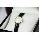 A ladies Accurist 9ct gold wristwatch, the circular white dial with Arabic numerals,
