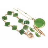 A collection of assorted nephrite and green stone set jewellery,