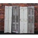 Four 19th century French grey painted rustic window shutters, 66cm H x 26cm W,