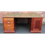 An Edwardian mahogany partners desk,