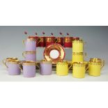 A set of six Coalport coffee cups and saucers with silver gilt spoons, Mappin & Webb,