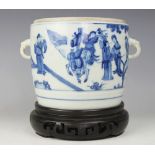 A Chinese porcelain blue and white jar on carved hardwood stand,