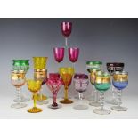 A selection of 19th century and later coloured glasses to include a large yellow glass example with