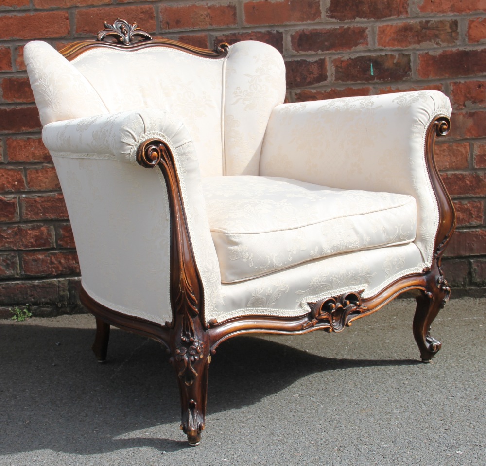 A French Louis XVI style carved and stained walnut salon suite, with floral ivory upholstery, - Image 3 of 7