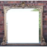 A large Victorian carved gilt wood and gesso over mantel mirror,