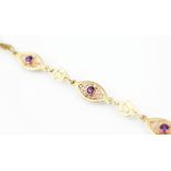 A Clogau gold amethyst set bracelet, designed as four navette shaped panels,