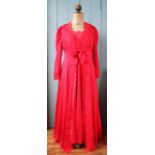 A Charlotte Hilton red satin night gown, with lace trim,