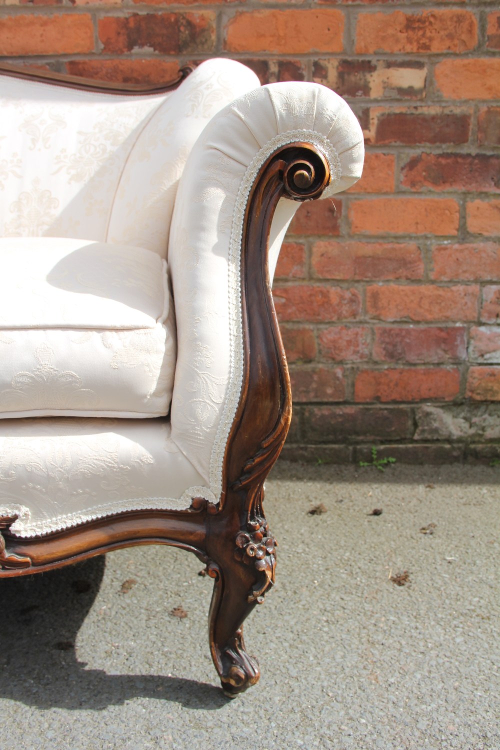 A French Louis XVI style carved and stained walnut salon suite, with floral ivory upholstery, - Image 7 of 7