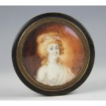 An early 19th century tortoiseshell circular snuff box and cover,