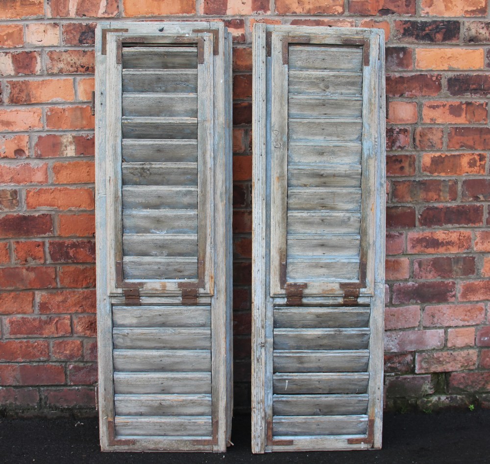 A pair of 19th century French grey painted rustic slatted window shutters, with cast iron furniture, - Image 2 of 2