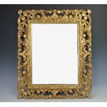 A 19th century carved gilt wood and gesso Florentine type wall mirror, with scroll frame,