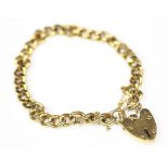 A 9ct gold curb link bracelet, with attached padlock clasp and safety chain, sponsors mark 'GJ Ld',