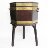 A George III brass bound mahogany cellarette on stand, with original lead lined interior,