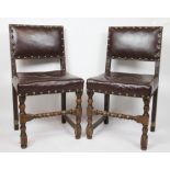 A set of six 17th century style dining chairs, with brass studded leatherette upholstery,